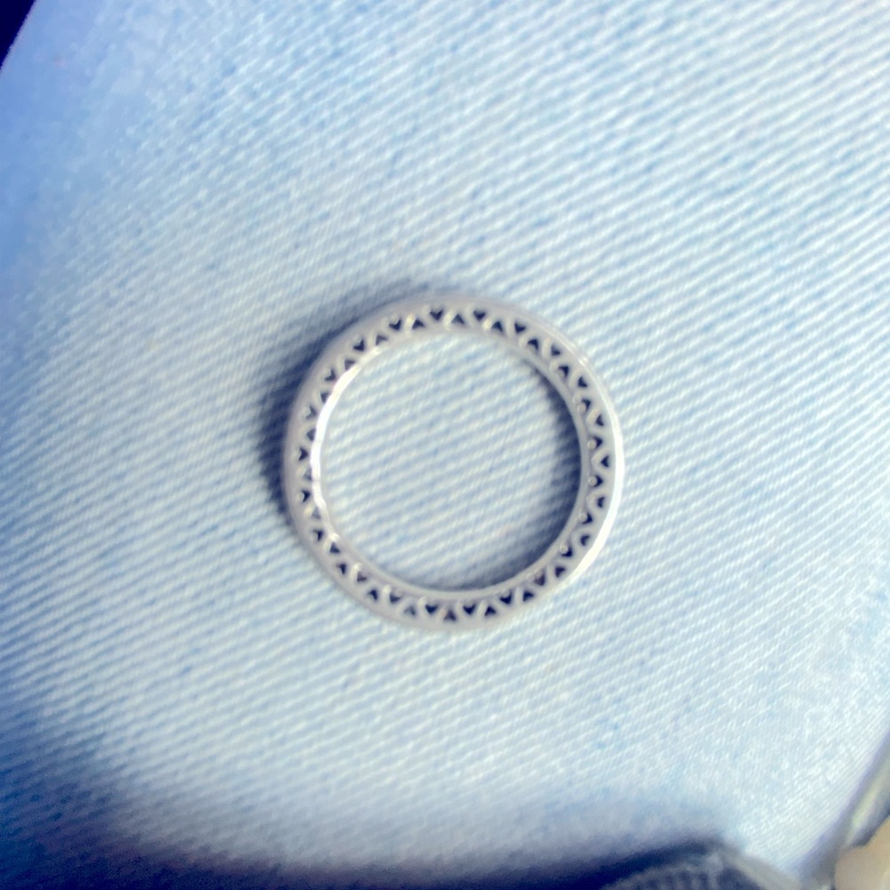 Pandora plain silver band with hearts on putter side